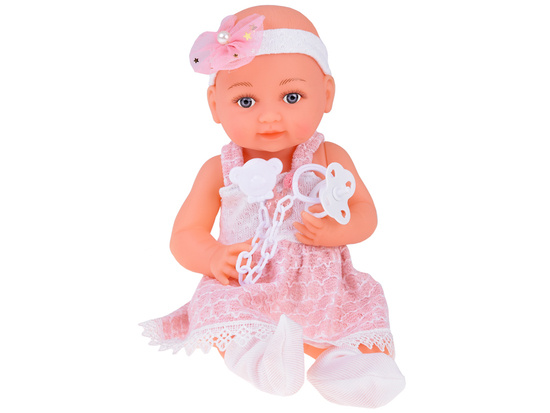 Rubber baby doll in a pink dress, bottle, pacifier ZA5235