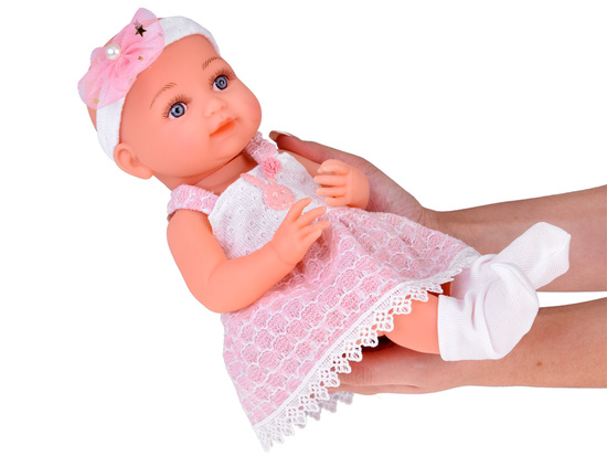 Rubber baby doll in a pink dress, bottle, pacifier ZA5235