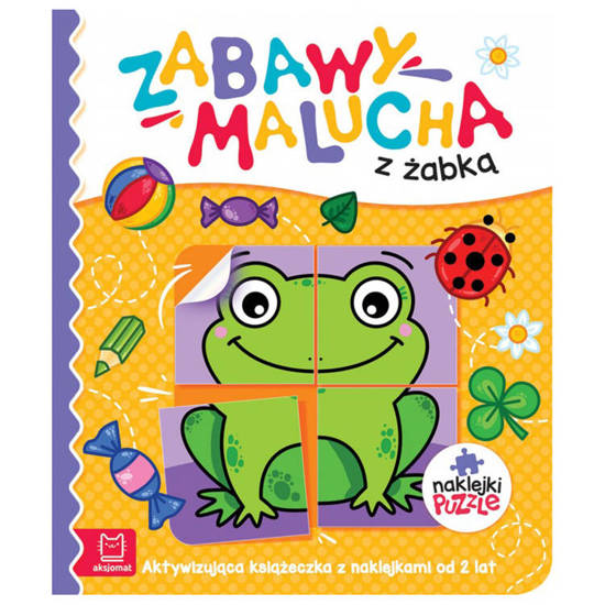 Toddler playing with a frog book with stickers KS0826